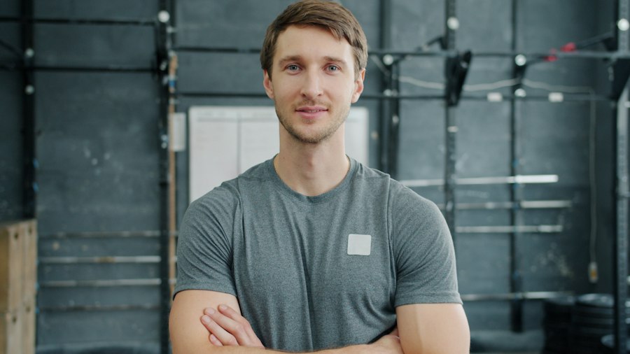 A gym owner with arms crossed